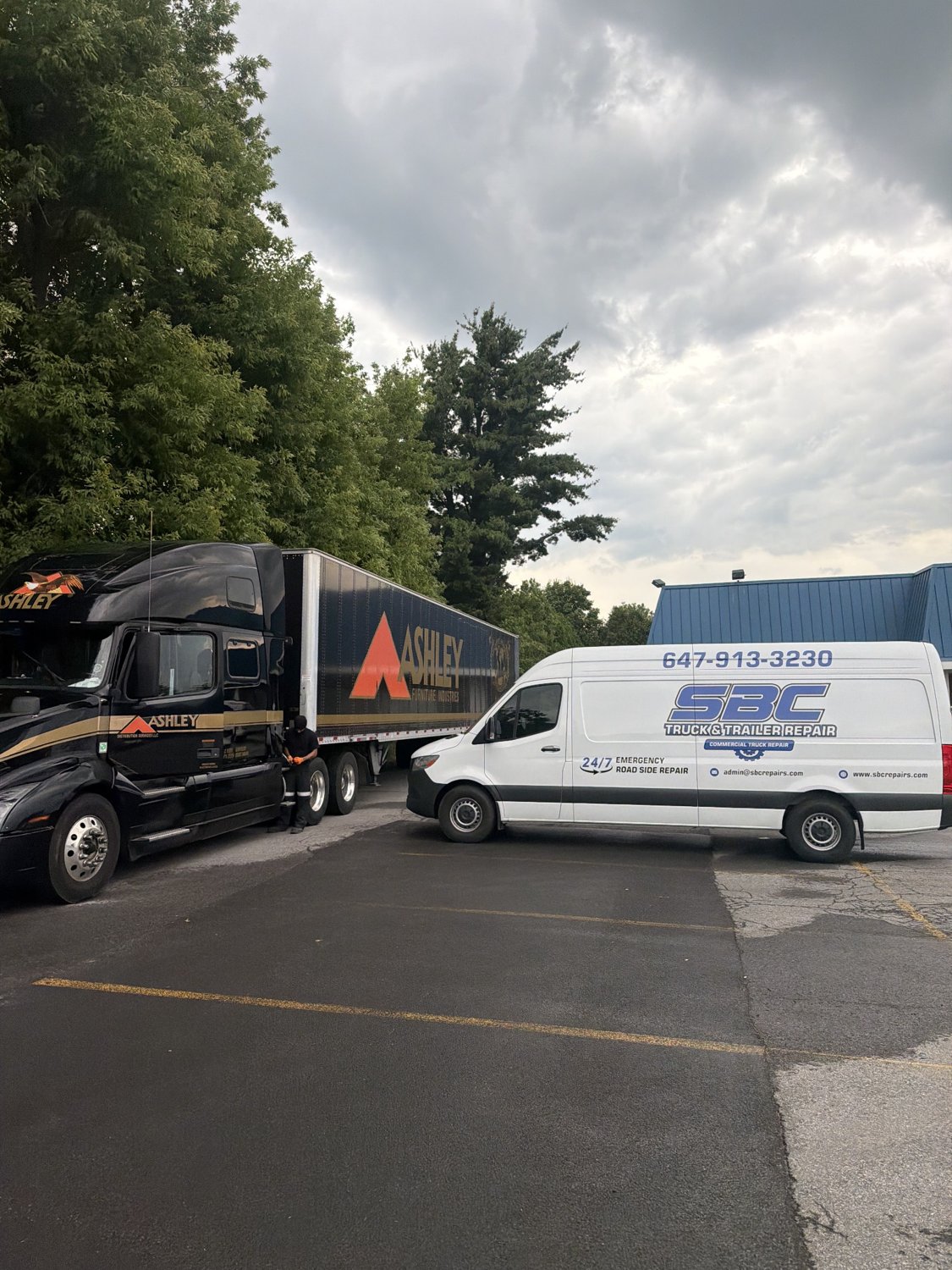 SBC Truck and Trailer Repair service van beside transport truck